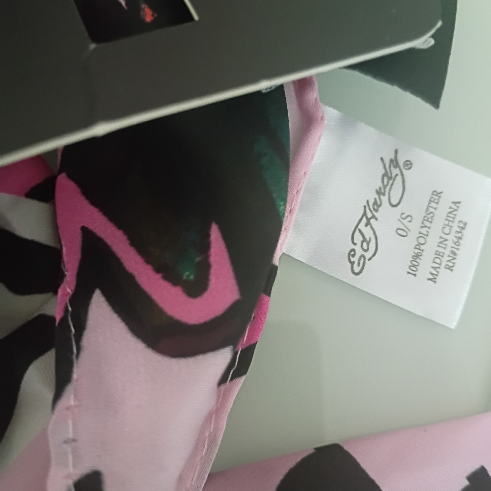 New Ed Hardy pink, multi-function scarf with a skull and roses tattoo print. - Picture 2 of 5